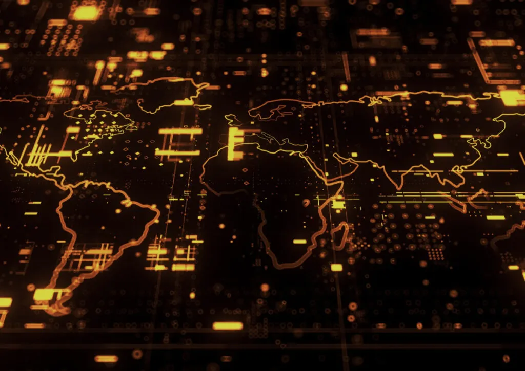 Um mapa-múndi preto e laranja na tela de um computador, utilizado para geomarketing.