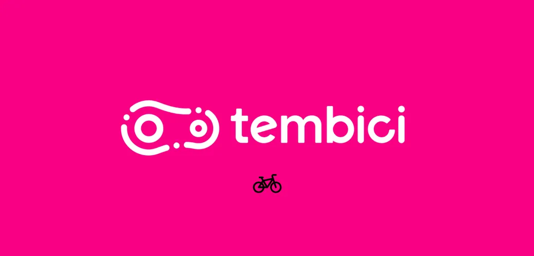 Logotipo da Tembici em fundo rosa, nome da marca e um pequeno ícone de bicicleta abaixo.